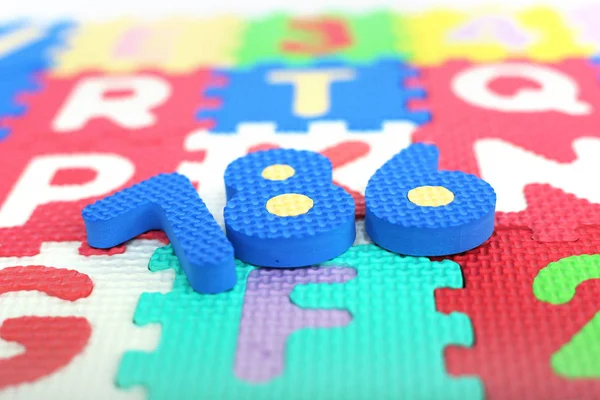 Picture of numbers on the letters of the colored alphabets.