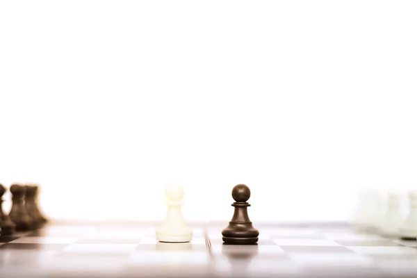 Picture of the chess board game with chess pawns. Isolated on the white background.