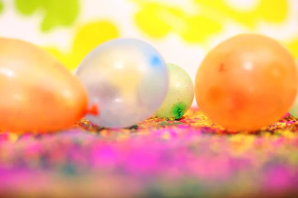 Picture of colorful water balloons for holi fun. Isolated on the colorful background.