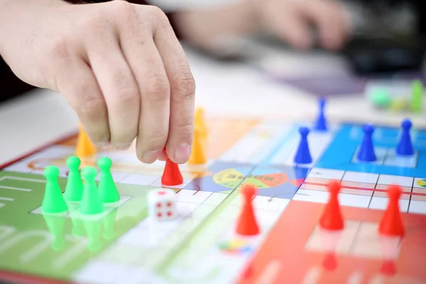 Man started playing ludo game. Isolated on white background. - Stock Image  - Everypixel