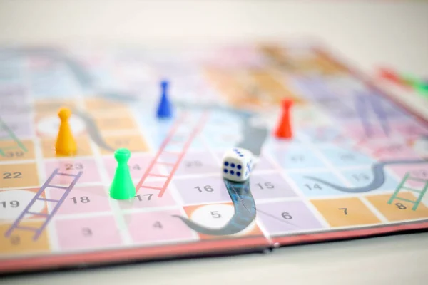 Snakes and Ladders board Game. Isolated on white background..