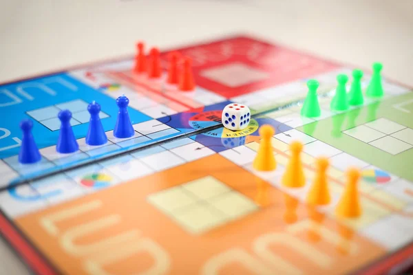 Picture of different colored tokens on ludo.  Isolated on white background.