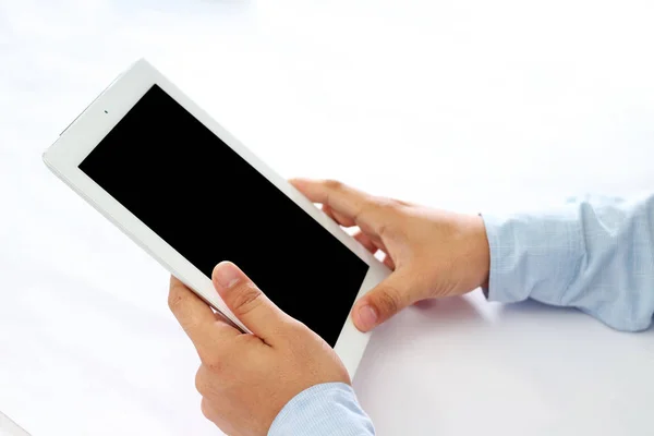 Man working on tablet. Isolated on white background.