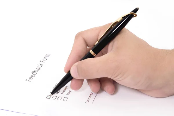 Picture of Man filling feedback form with a pen. Isolated on white background.