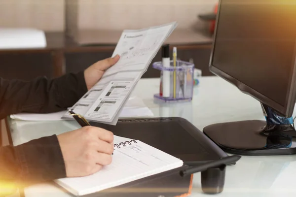 Picture of businessman working with documents in office. Isolated on white background.