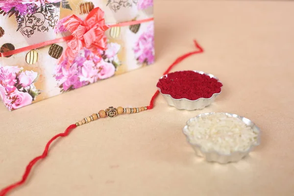 Indian Festival Raksha Bandhan Background Elegant Rakhi Rice Grains Kumkum — Stock Photo, Image