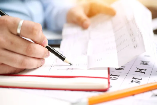 Picture of Calendar and man holding list in hand. Isolated on white background.