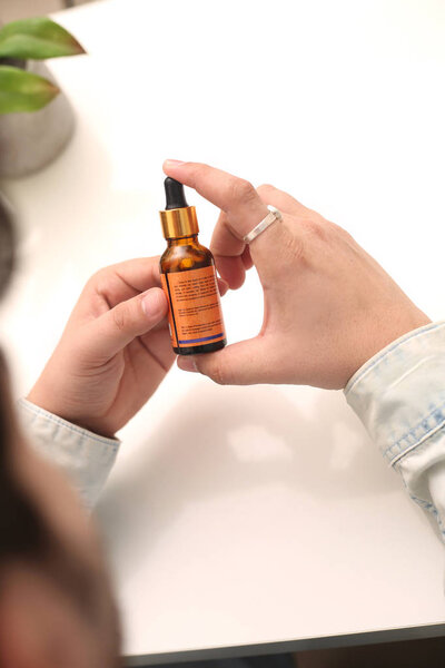 Picture of man drop medicine bottle holding in hand. Isolated on white background.