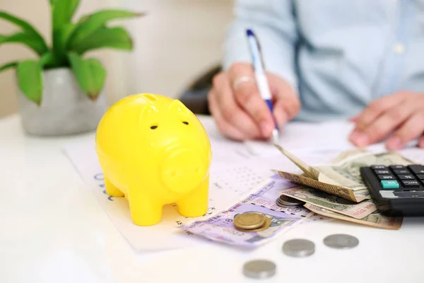 Picture Person Depositing Money Yellow Piggy Bank Isolated Background — Stock Photo, Image