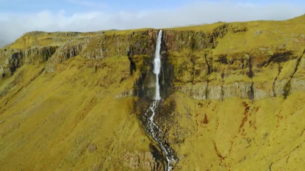 Aerial view of beautiful small waterfall in Iceland during the spring. — Stock Video