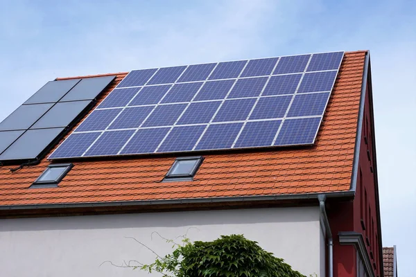 Solar energy panels on roof of house Stock Photo