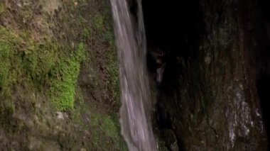 waterfall deep into the mountains