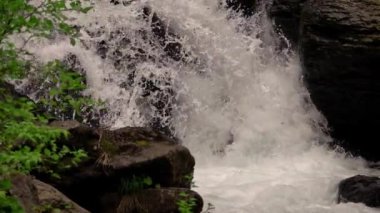 waterfall deep into the mountains in slow motion