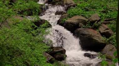 waterfall deep into the mountains in slow motion