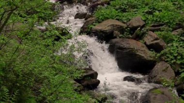 waterfall deep into the mountains in slow motion