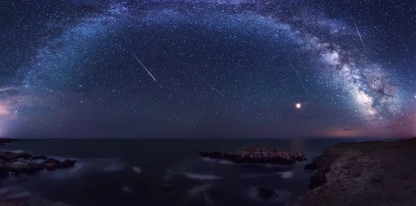 Long time exposure night landscape with planet Mars and Milky Way Galaxy during the Perseids flow above the Black sea, Bulgaria