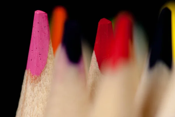 Grouping of colored pencils vertically on black background. Back to school. — Stock Photo, Image