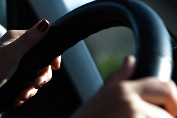 Hands of person driving a vehicle. Technology and traffic.