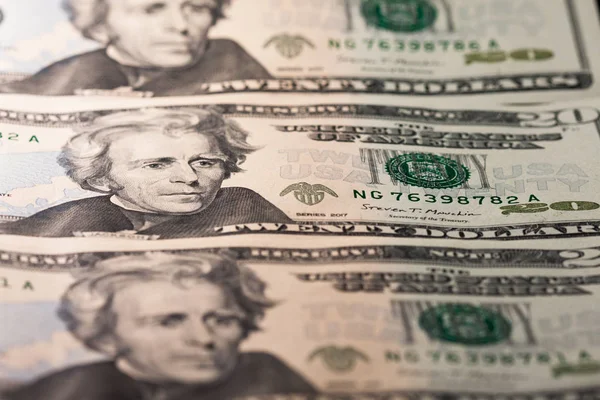 Twenty dollar bill. 20 dollar bill. Image isolated on black background. Banknotes placed in order, the face of President Jackson of the United States.