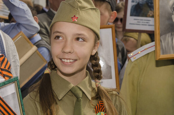 Girl in uniform at the parade of victory