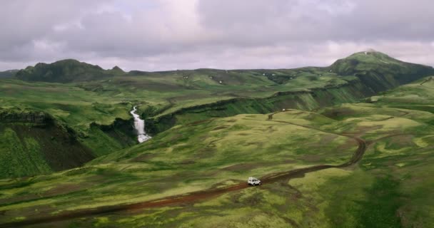 Aerial View Tracking Shot Silver Car Driving Iceland Mountains Road — Stock Video