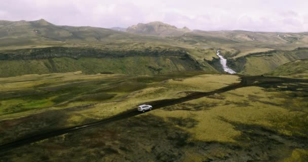 Aerial View Tracking Shot Silver Car Driving Iceland Mountains Road — Stock Video