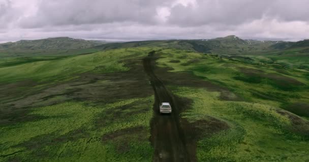 Aerial View Tracking Shot Silver Car Driving Iceland Mountains Road — Stock Video