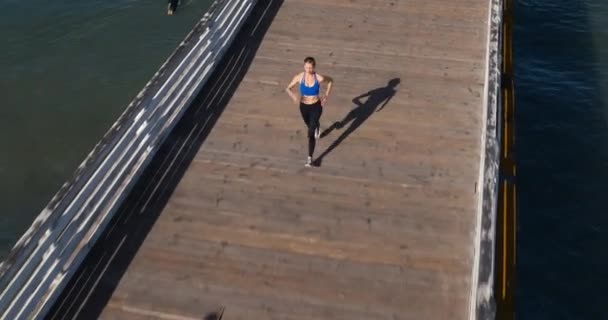 Aerial Shot Active Healthy Young Woman Running Ocean Pier — Stock Video