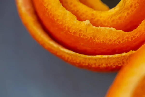 Macro citrus fruit peel. Background with peel a tangerine. Art image with a peel mandarin. Closeup and texture with a peel an orange. A concept for a decor food. Top view. Soft focus. Copy space. Art photography