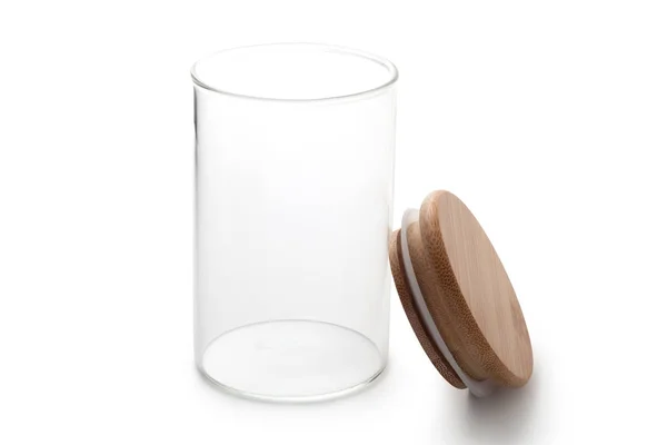白い背景の上のふた付きの空のガラスの瓶 — ストック写真