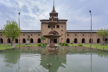 Jammu and Kashmir, India - April 14, 2019 : Jamia Masjid is a mosque at Nowhatta in the old city in downtown it is one of tourist attractions in Srinagar, Jammu & Kashmir, India clipart