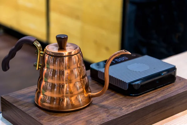 Copper Kettle Siphon vacuum coffee maker and coffee grinder with drip brewing filtered coffee or pour-over is a method involves pouring hot water over roasted coffee beans