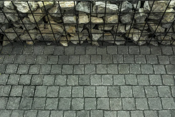 Granite flooring cobbled road, Brick stone street road. Pavement abstract texture.