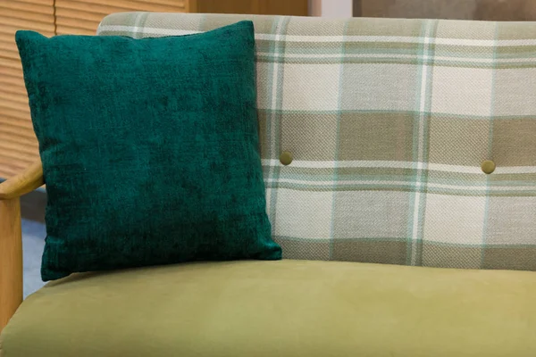 Modern green fabric pillow on luxury green fabric sofa interior decoration contemporary