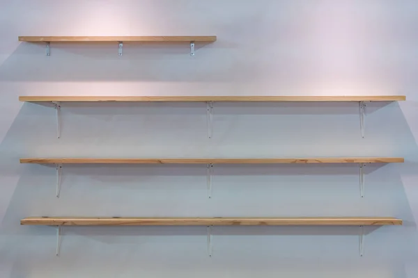 Wooden wall shelf or shelves for display product on white wall panel background interior decoration
