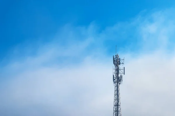 Telecommunications equipment, Cell Phone Antenna Tower, Wireless communication, Mobile phone tower, with mist in morning sky.