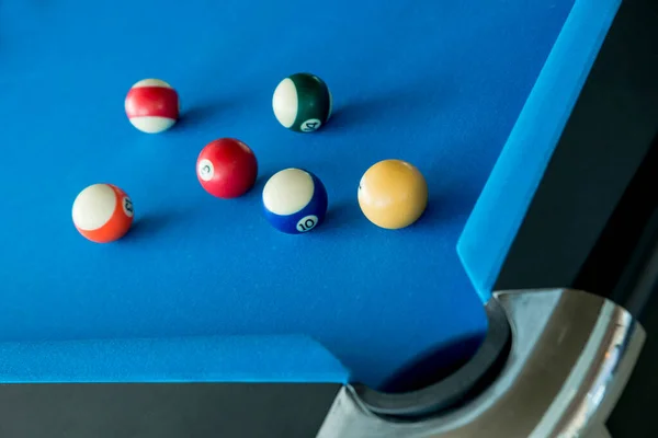Balls of American Pool or Snooker billiard game any of various games played on blue flannel table in which cues are used to strike balls against each other pockets around the edge of the table
