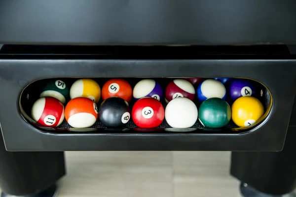 Balls of American Pool or Snooker billiard game any of various games played on green flannel table in which cues are used to strike balls against each other pockets around the edge of the table