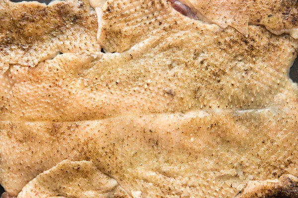 Raw skin taken from a duck. Goose skin, after plucking the feathers and removing the pinfeathers with an open flame. Goose skin texture. Royalty Free Stock Images