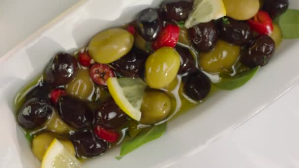 Top View Lemon Black Green Olives White Plate — Stock Video