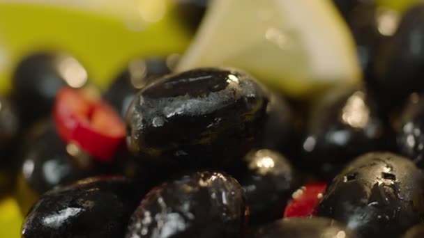 Slow Motion Black Olives Falling Salad — Stock Video