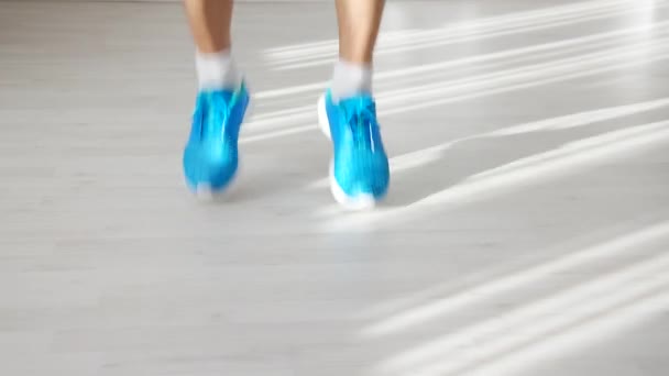 Close Feet Athletic Man Blue Trainers Approaching Skipping Rope Taking — Stock Video