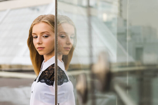 Portrait of girl with her glass reflection