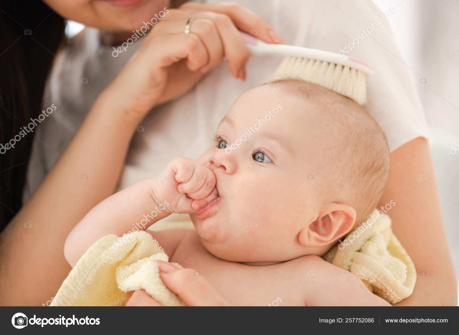 Smiling woman combing hair her baby girl. Stock Photo by ©160275 257752086 Smiling woman combing hair her baby girl. Stock Photo by ©160275 257752086
