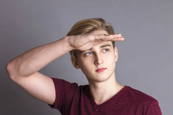Boy Teenager Looks Away Raised Arm Grey Studio Close Portrait — Stock Photo, Image