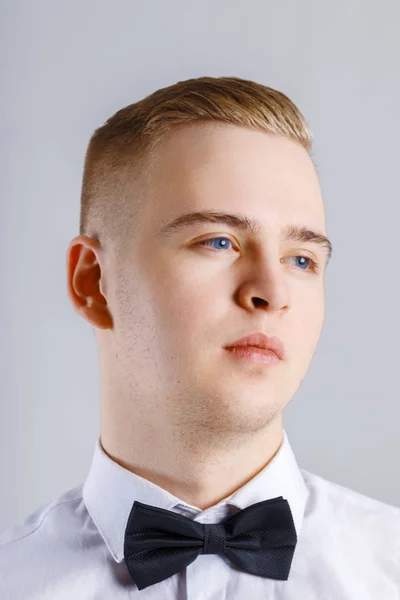 Young Man White Shirt Black Bow Tie Poses Studio Close — Stock Photo, Image