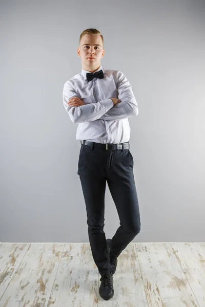 Handsome Young Man White Shirt Bow Tie Poses Grey Studio — Stock Photo, Image