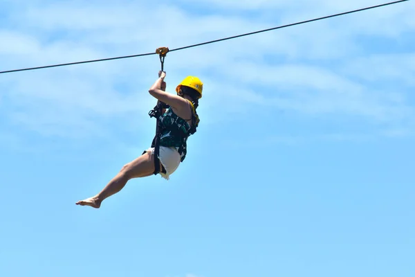 sky, jump, blue, jumping, child, sport, cable, high, fun, rope, electricity, bungee, woman, power, climbing, mountain, ski, lift, extreme, line, swing, young, hanging, nature, snow