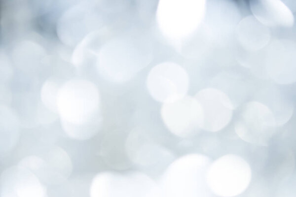 Bokeh gray background of beautiful lights. Concept Christmas