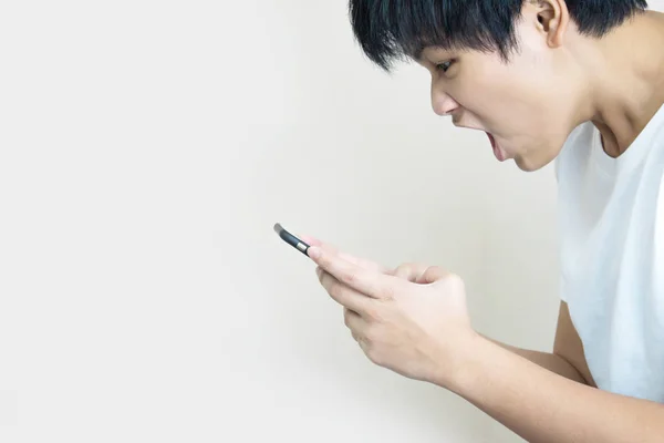 Asian people wear a white T-shirt to show a shocked or angry exp